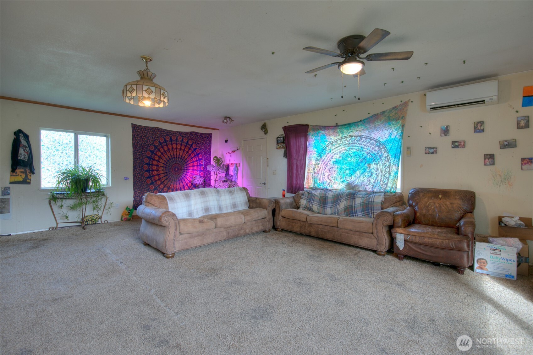 102 Elma Street Copalis Beach, WA 98535 - Photo 11 of 23 a living room with furniture and a flat screen tv