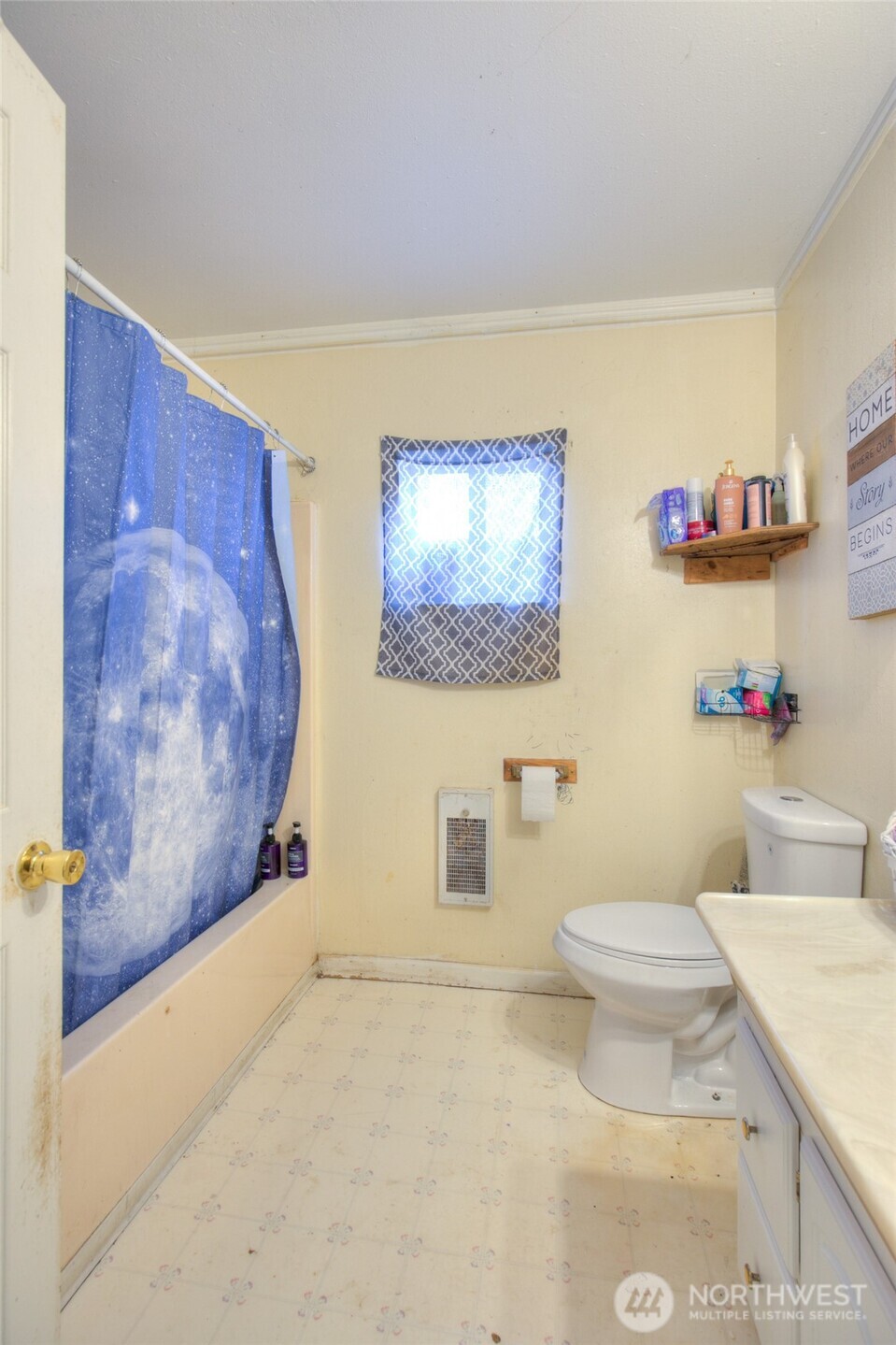 102 Elma Street Copalis Beach, WA 98535 - Photo 14 of 23 a bathroom with a toilet sink and mirror