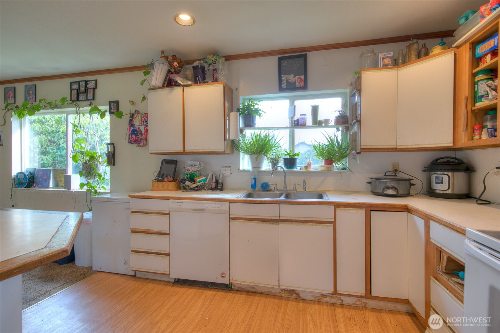 102 Elma Street Copalis Beach, WA 98535 - Photo 8 of 23 a kitchen with a sink cabinets and window