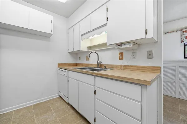 a kitchen with stainless steel appliances granite countertop a stove and a refrigerator