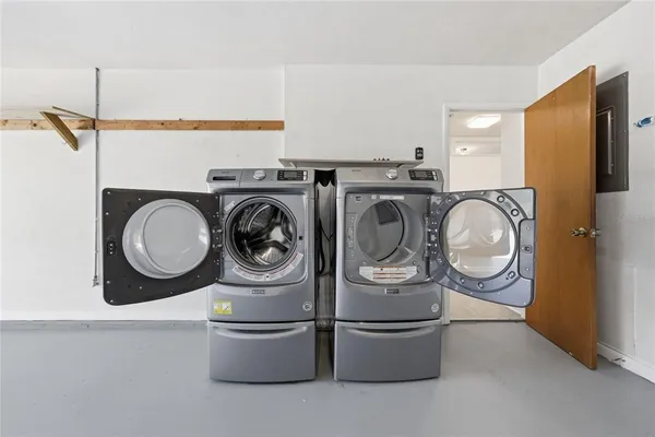 front view of a house with potted plants
