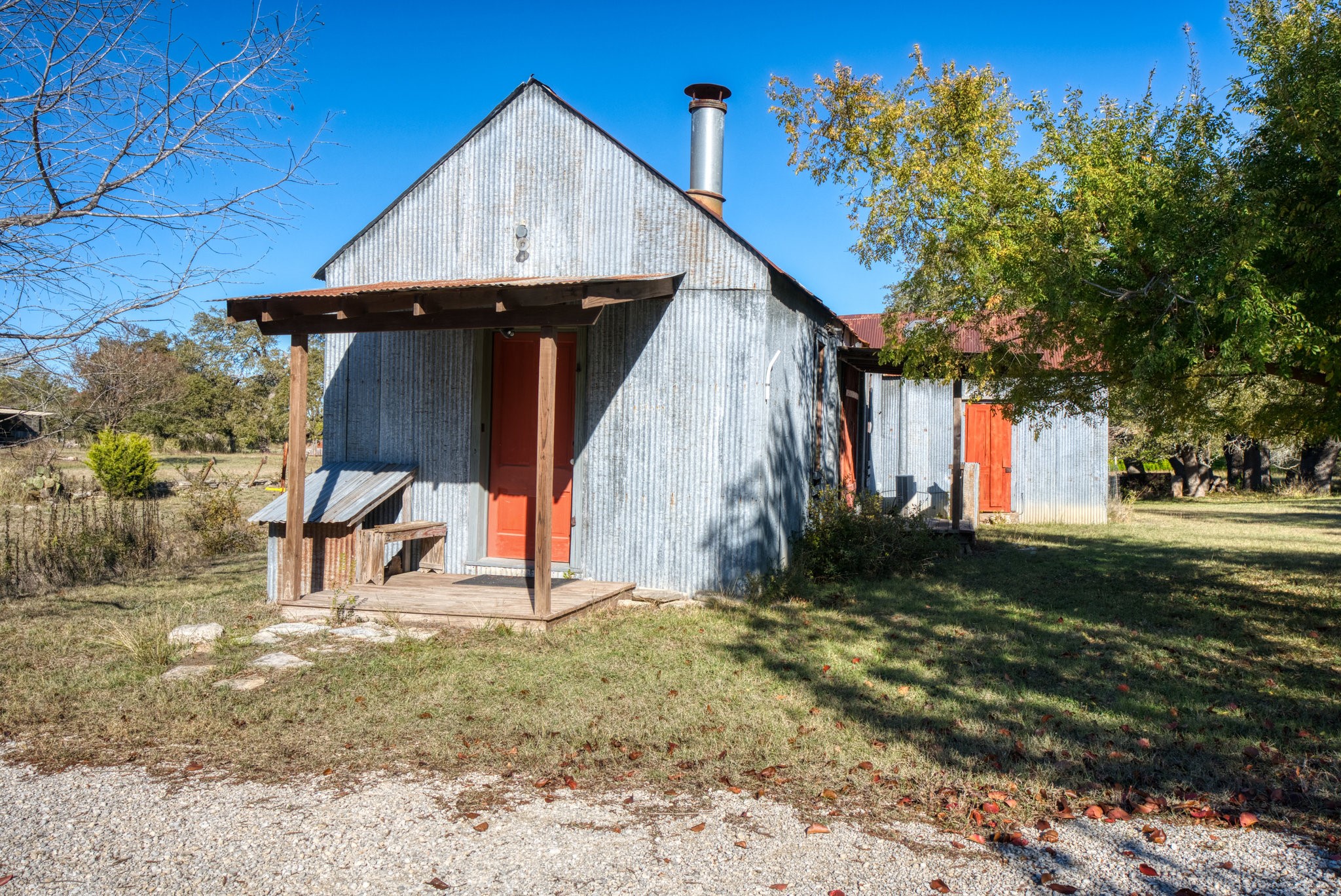 115 Fischer Store Road Fischer, TX 78623 - Photo 20 of 45 a view of backyard with a barn and a cactus tree