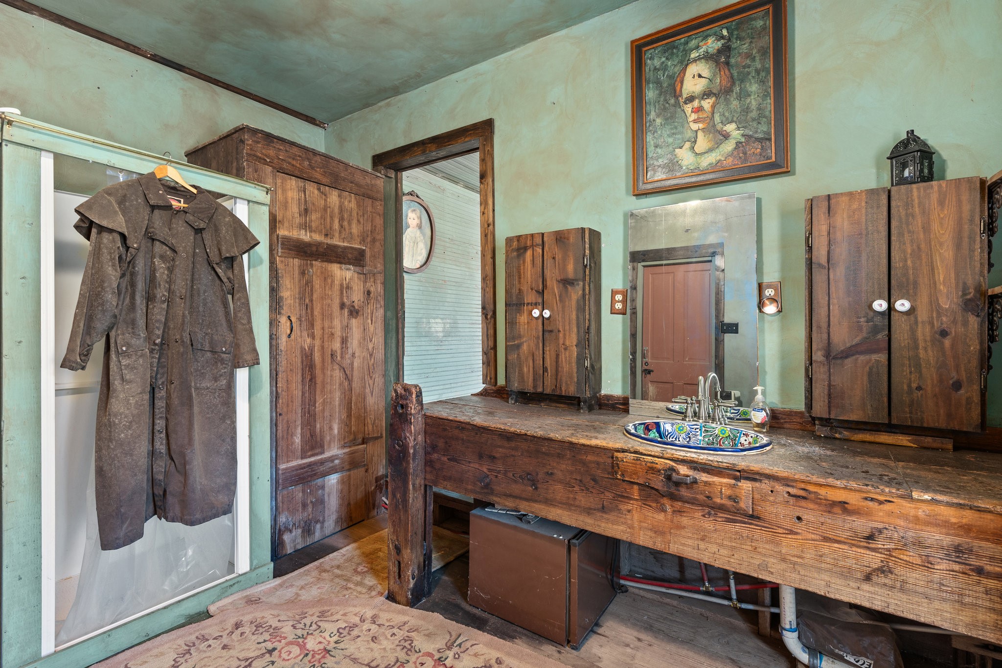 115 Fischer Store Road Fischer, TX 78623 - Photo 24 of 45 a bathroom with a double vanity sink and a mirror
