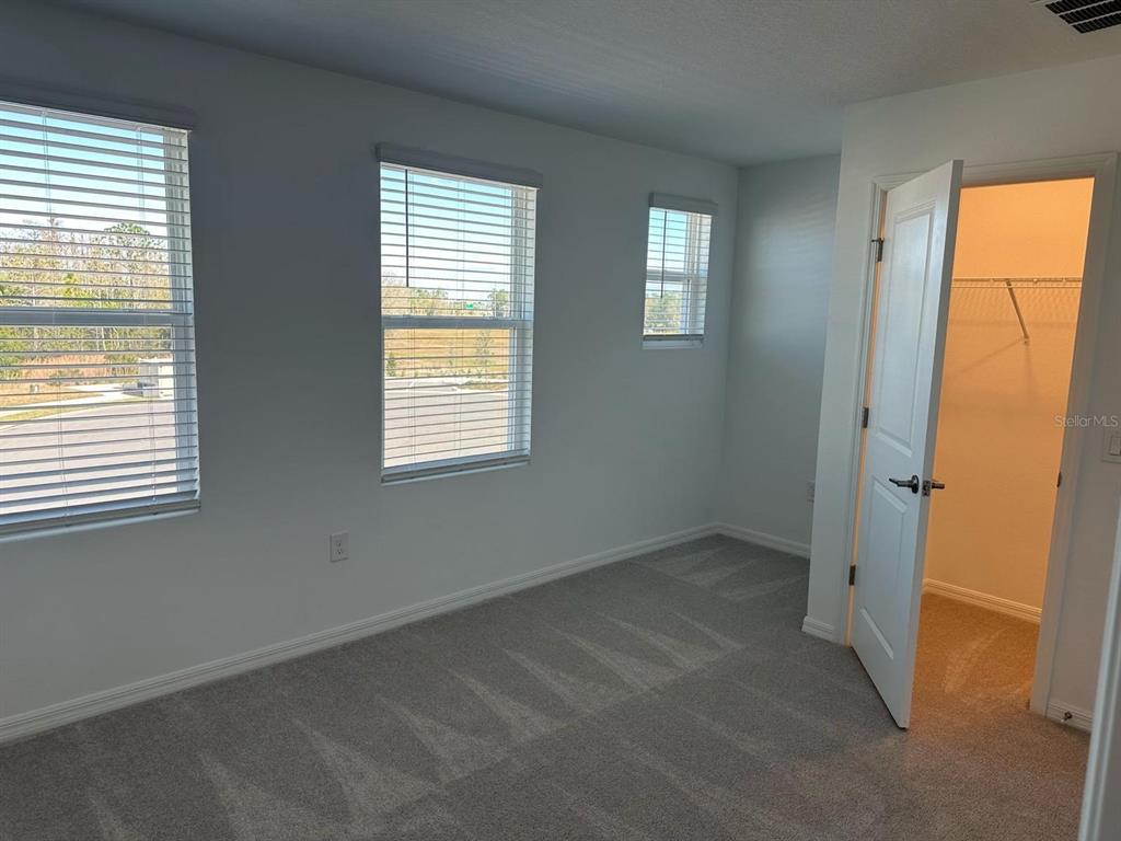 2084 Viewfinder Street Kissimmee, FL 34758 - Photo 15 of 18 an empty room with windows