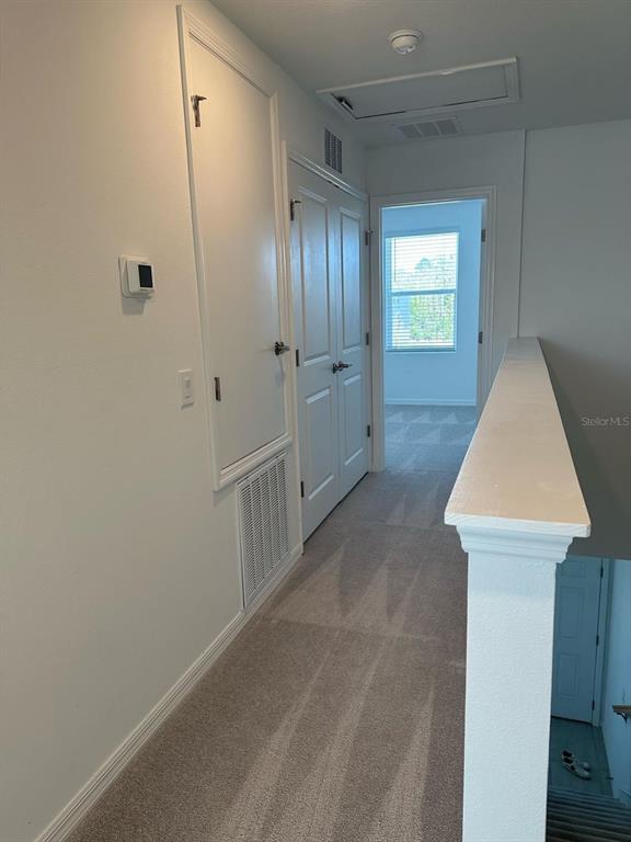 2084 Viewfinder Street Kissimmee, FL 34758 - Photo 9 of 18 a view of an empty room with window and closet area