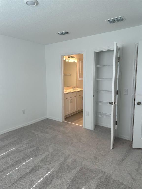 2084 Viewfinder Street Kissimmee, FL 34758 - Photo 10 of 18 a view of an empty room with closet area