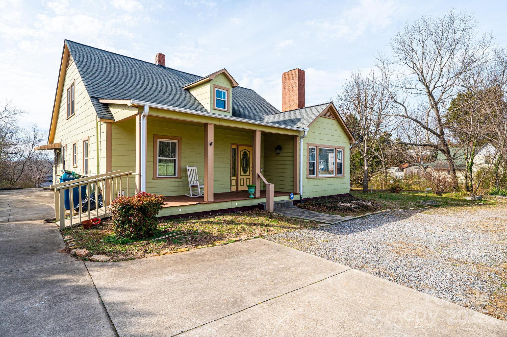 55 Duke Street Granite Falls, NC 28630 - Photo 1 of 45 a view of a white house with a large windows next to a road