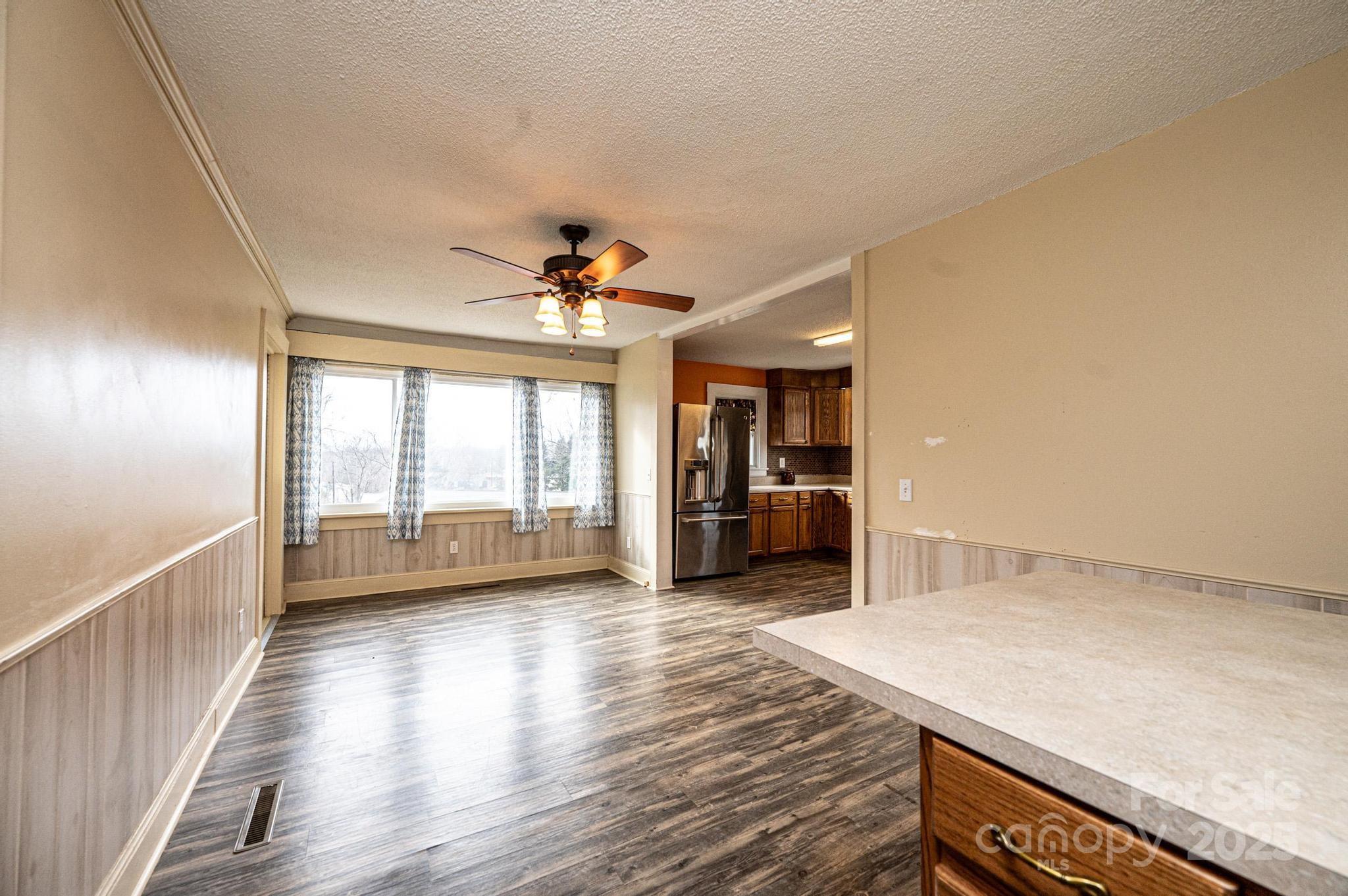 55 Duke Street Granite Falls, NC 28630 - Photo 12 of 45 a view of empty room with wooden floor and fan