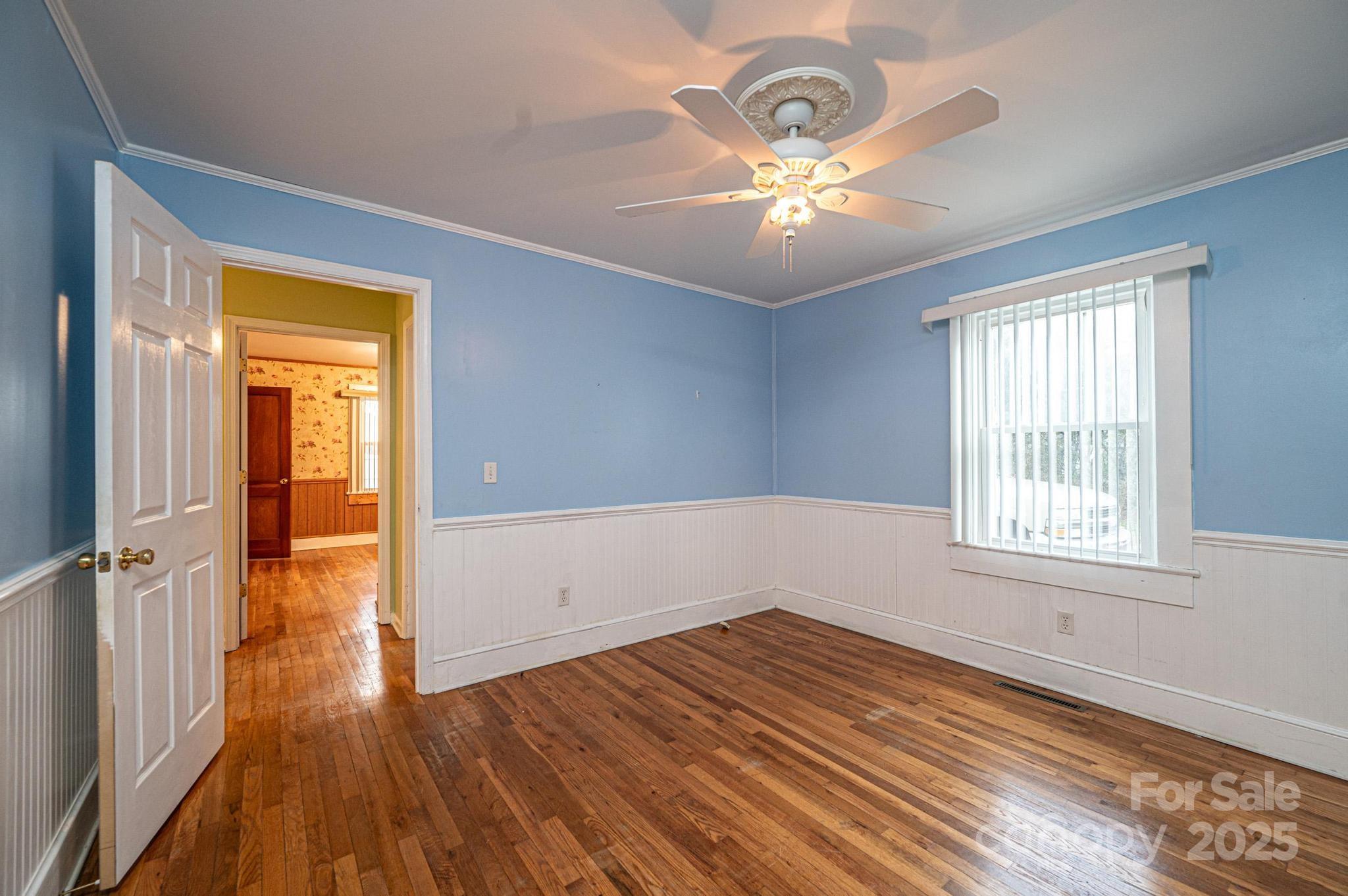 55 Duke Street Granite Falls, NC 28630 - Photo 15 of 45 wooden floor in an empty room with a window