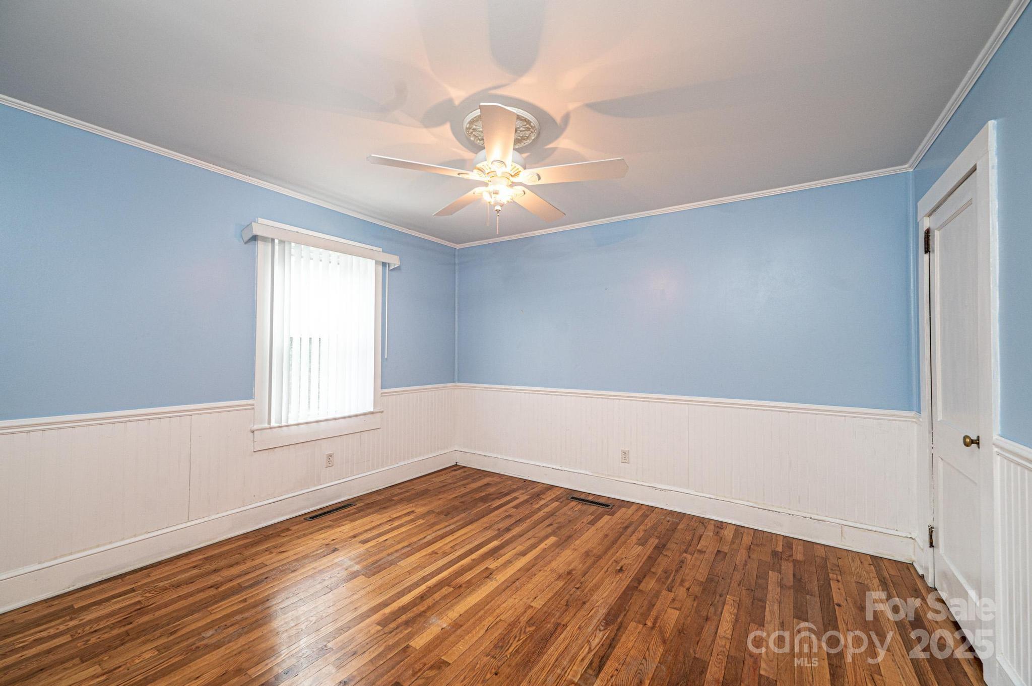 55 Duke Street Granite Falls, NC 28630 - Photo 16 of 45 wooden floor in an empty room with a window