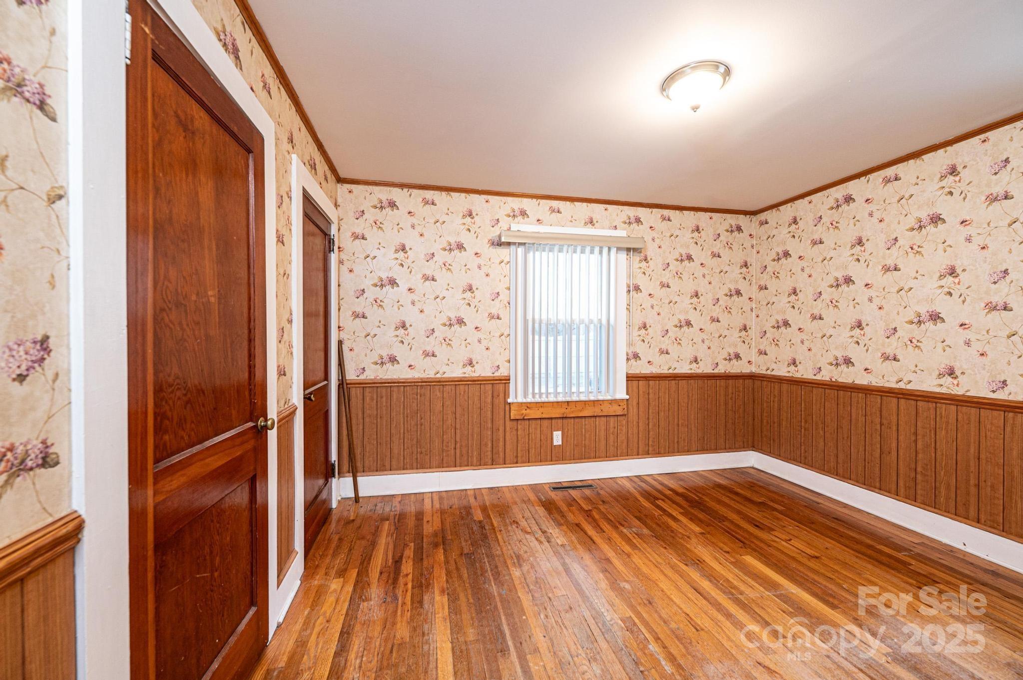 55 Duke Street Granite Falls, NC 28630 - Photo 19 of 45 a view of room with window and wooden floor
