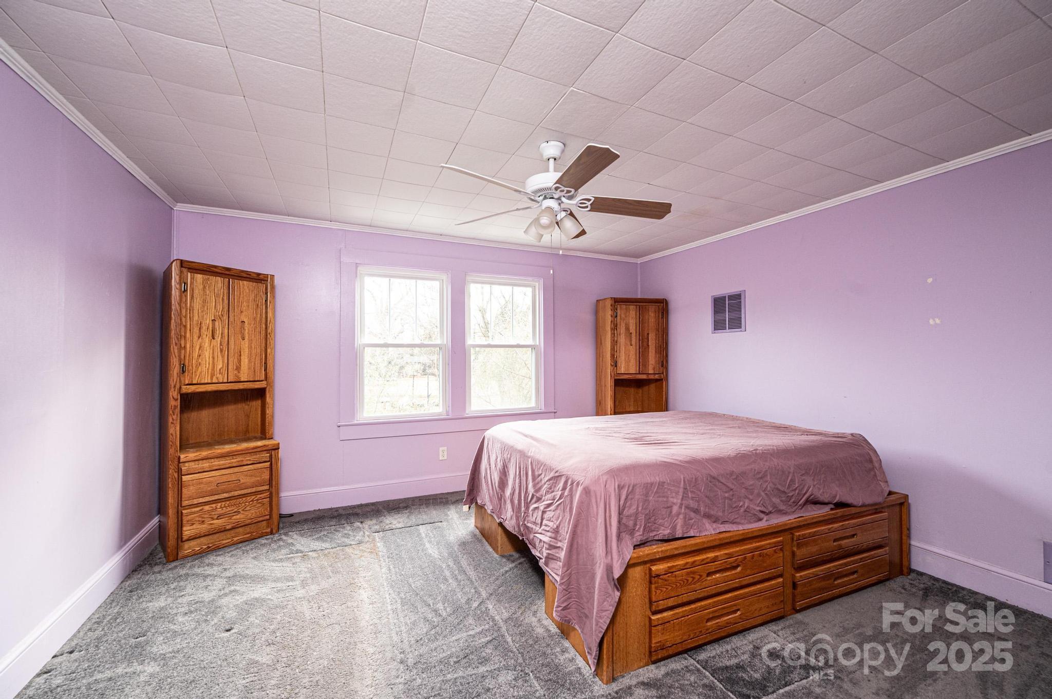 55 Duke Street Granite Falls, NC 28630 - Photo 20 of 45 a bedroom with a bed and a window
