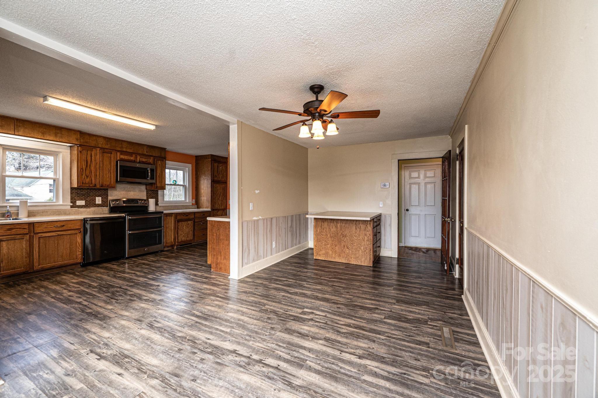 55 Duke Street Granite Falls, NC 28630 - Photo 25 of 45 a view of kitchen with sink and wooden floor
