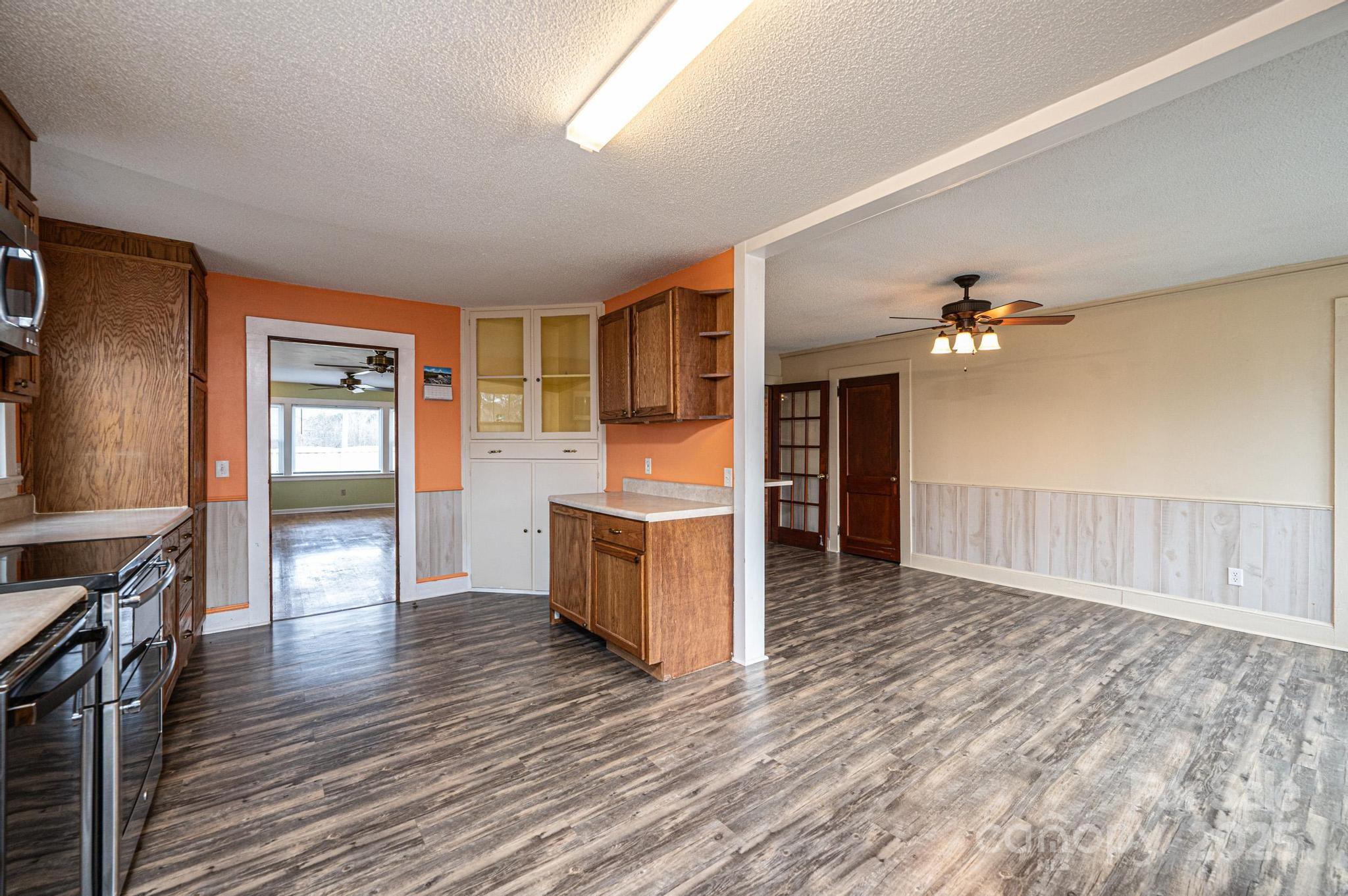 55 Duke Street Granite Falls, NC 28630 - Photo 27 of 45 a view of a kitchen with a sink cabinets and wooden floor