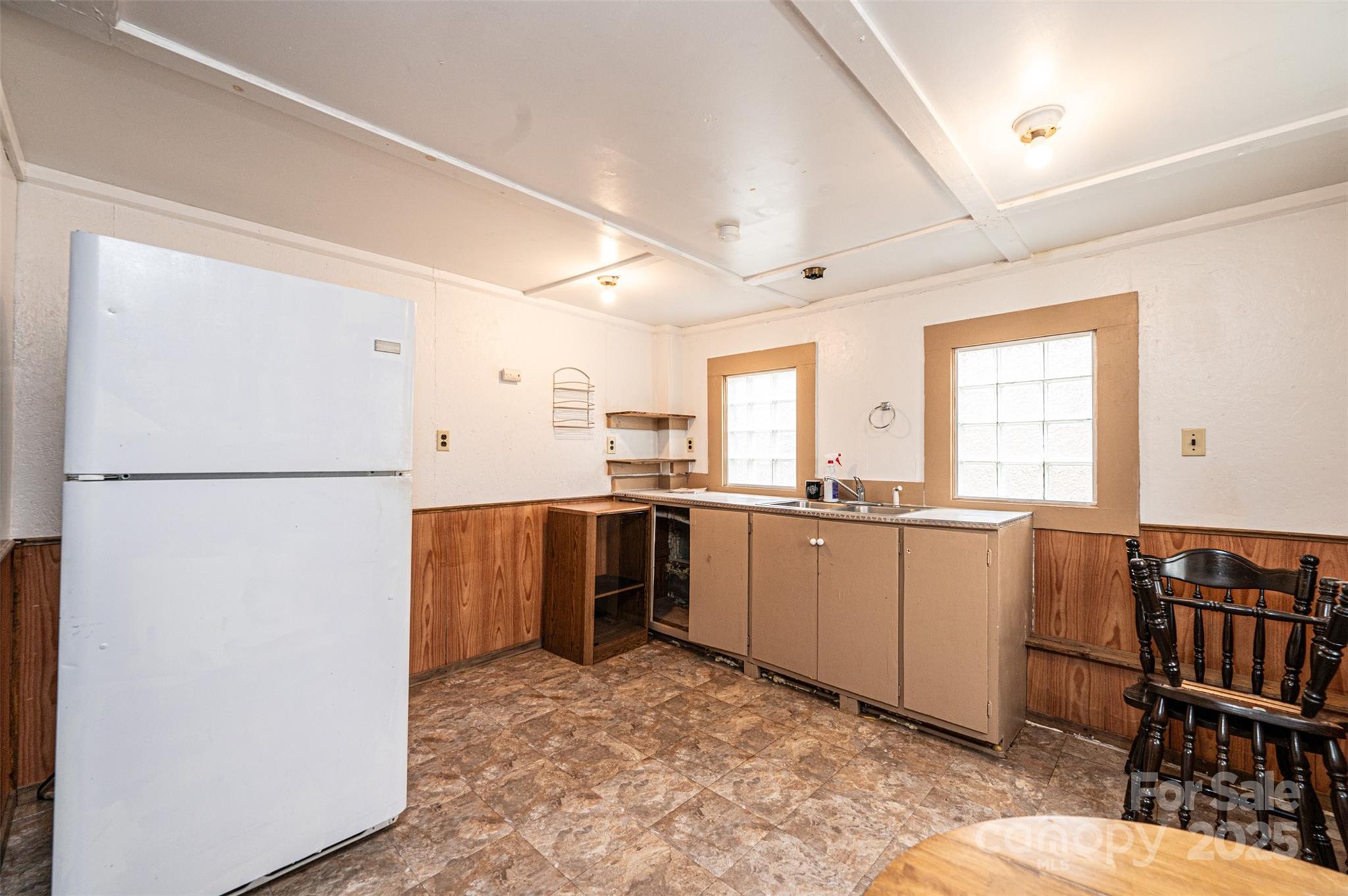 55 Duke Street Granite Falls, NC 28630 - Photo 32 of 45 a kitchen with refrigerator and window