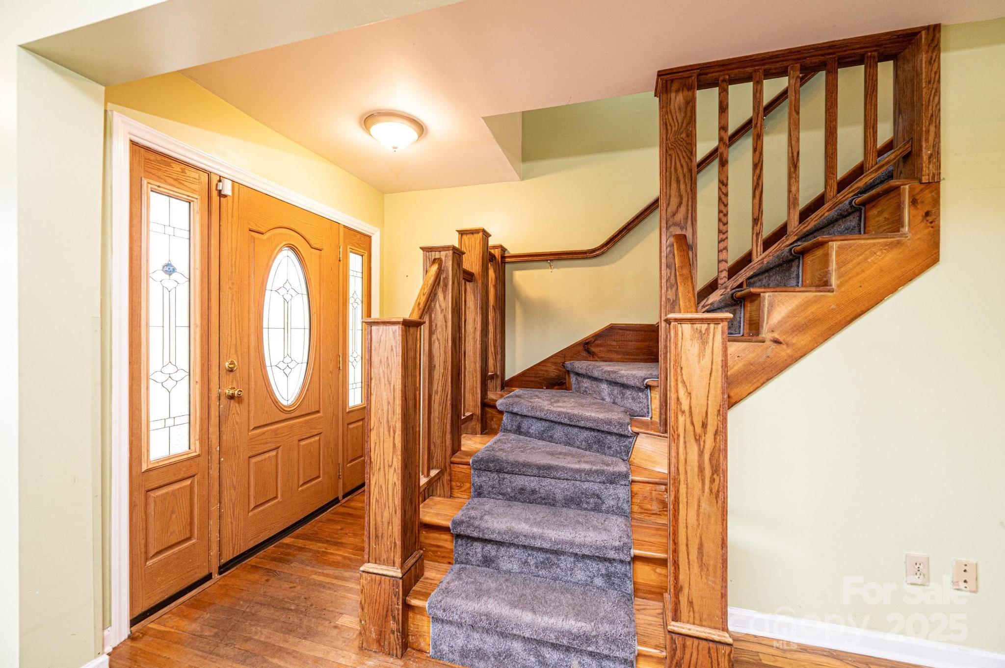 55 Duke Street Granite Falls, NC 28630 - Photo 4 of 45 a view of an entryway with wooden floor and door