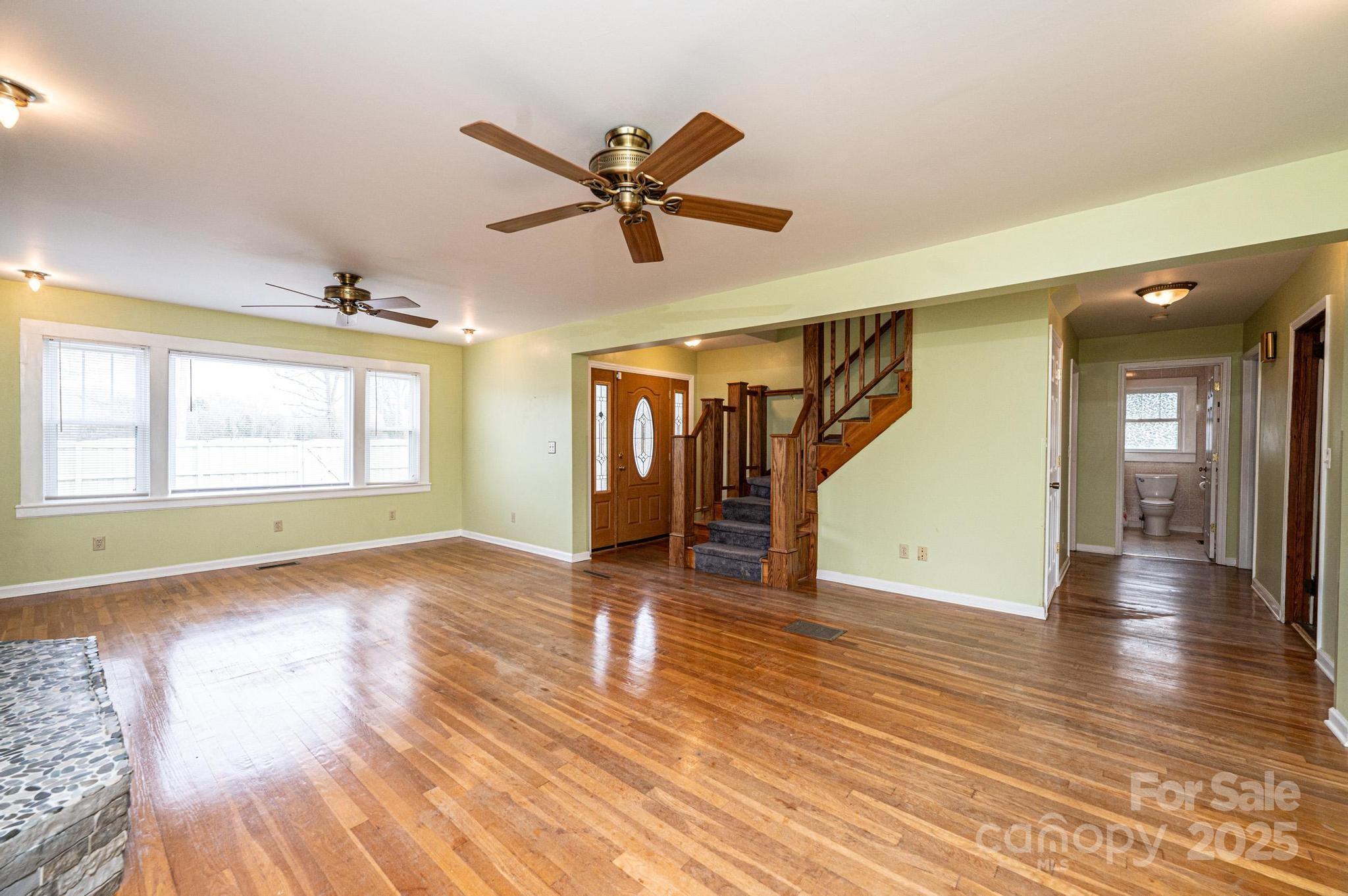 55 Duke Street Granite Falls, NC 28630 - Photo 6 of 45 a view of empty room with wooden floor and fan