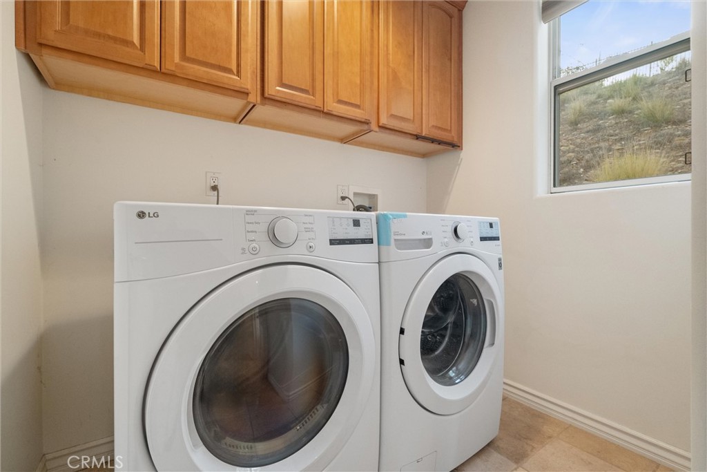 1259 Gonzales Road Simi Valley, CA 93063 - Photo 11 of 39 a utility room with dryer and washer