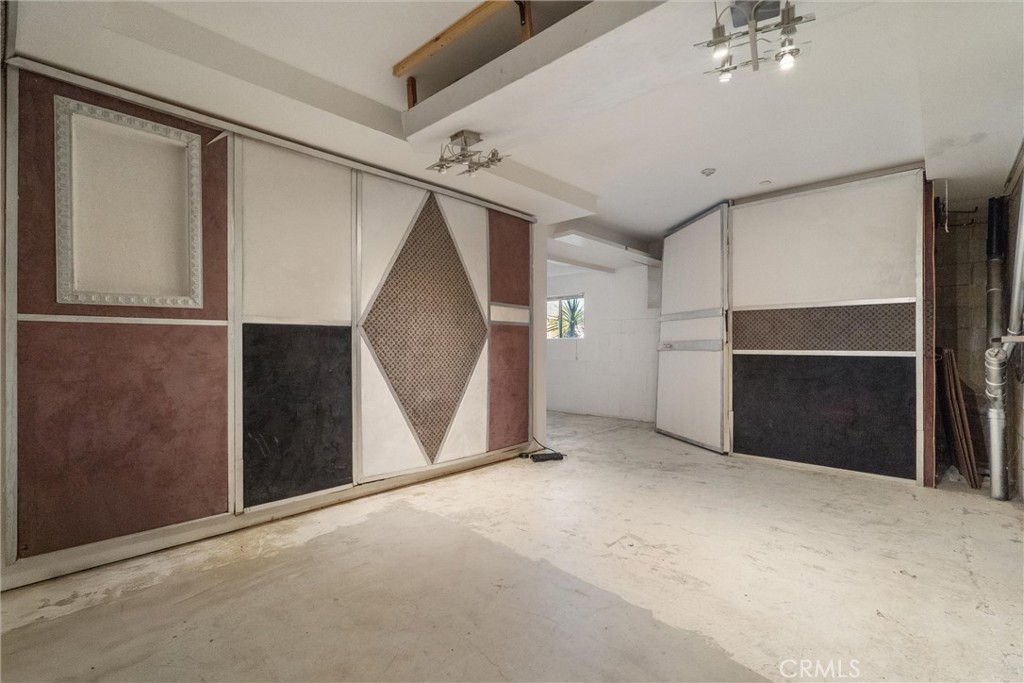 1259 Gonzales Road Simi Valley, CA 93063 - Photo 23 of 39 a view of an empty room with cabinet and a hallway