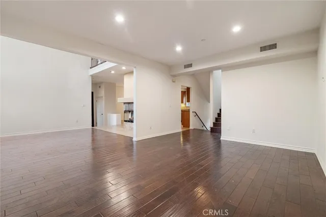 a kitchen with a sink stove top oven and refrigerator
