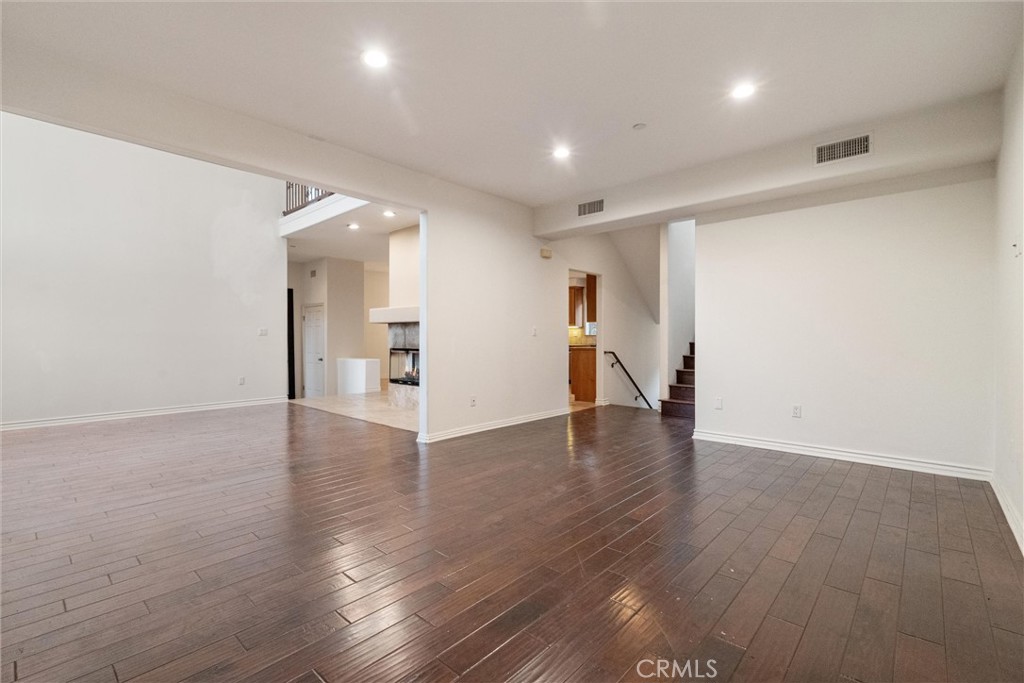 1259 Gonzales Road Simi Valley, CA 93063 - Photo 30 of 39 a view of a livingroom with wooden floor