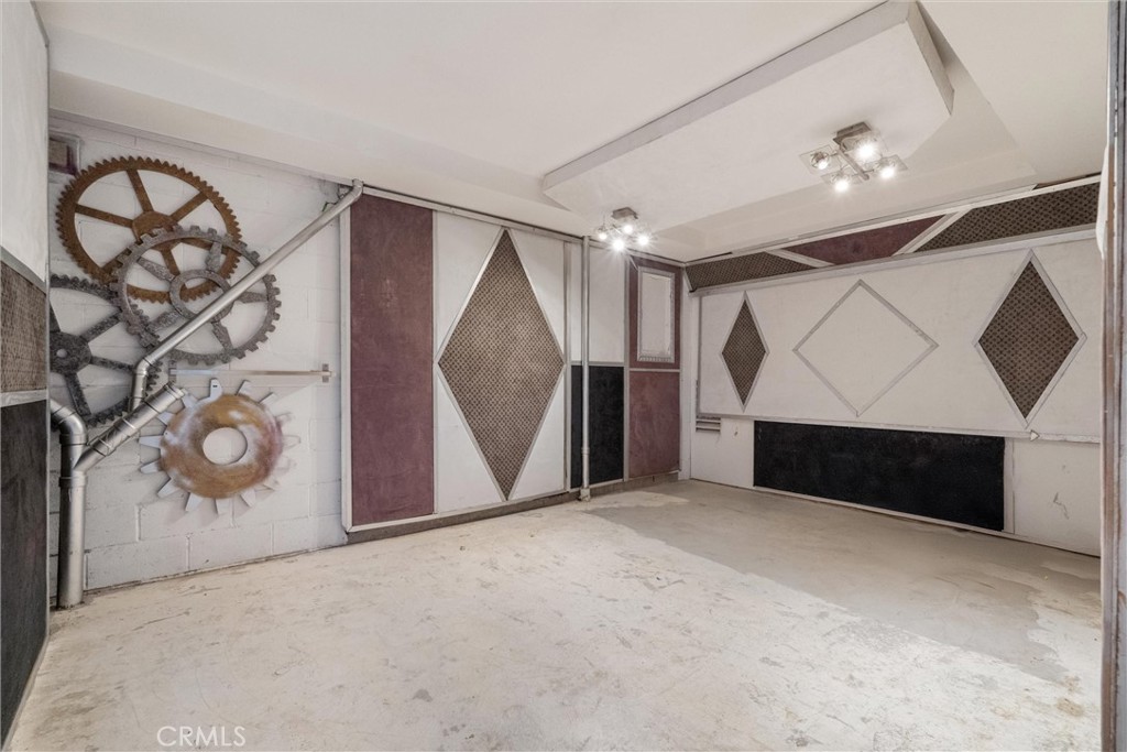 1259 Gonzales Road Simi Valley, CA 93063 - Photo 33 of 39 a view of an empty room with wooden floor and window