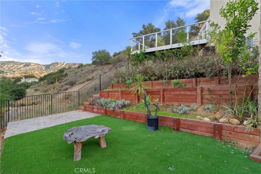 1259 Gonzales Road Simi Valley, CA 93063 - Photo 36 of 39 a green field with some trees in the background