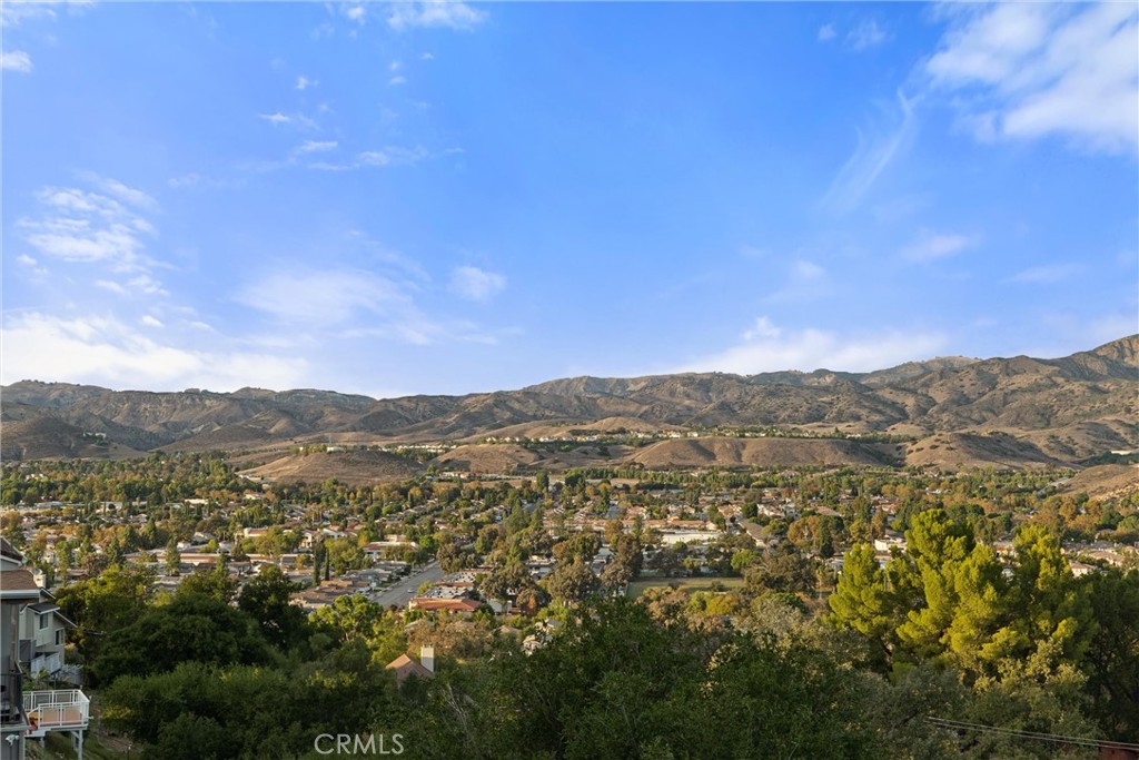 1259 Gonzales Road Simi Valley, CA 93063 - Photo 7 of 39 a view of a city with lush green forest
