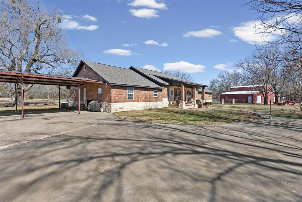 24 County Rd NW 1060 Talco, TX 75487 - Photo 35 of 40 a front view of a house with a yard