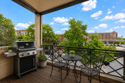 a view of a chairs and table in patio