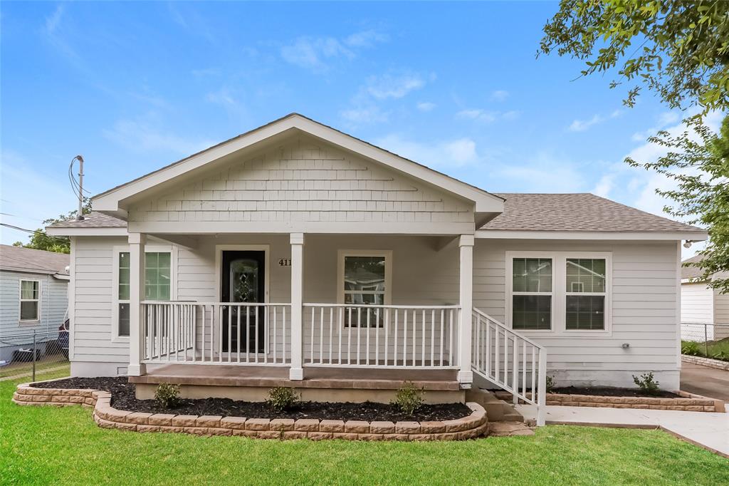 front view of a house with a yard