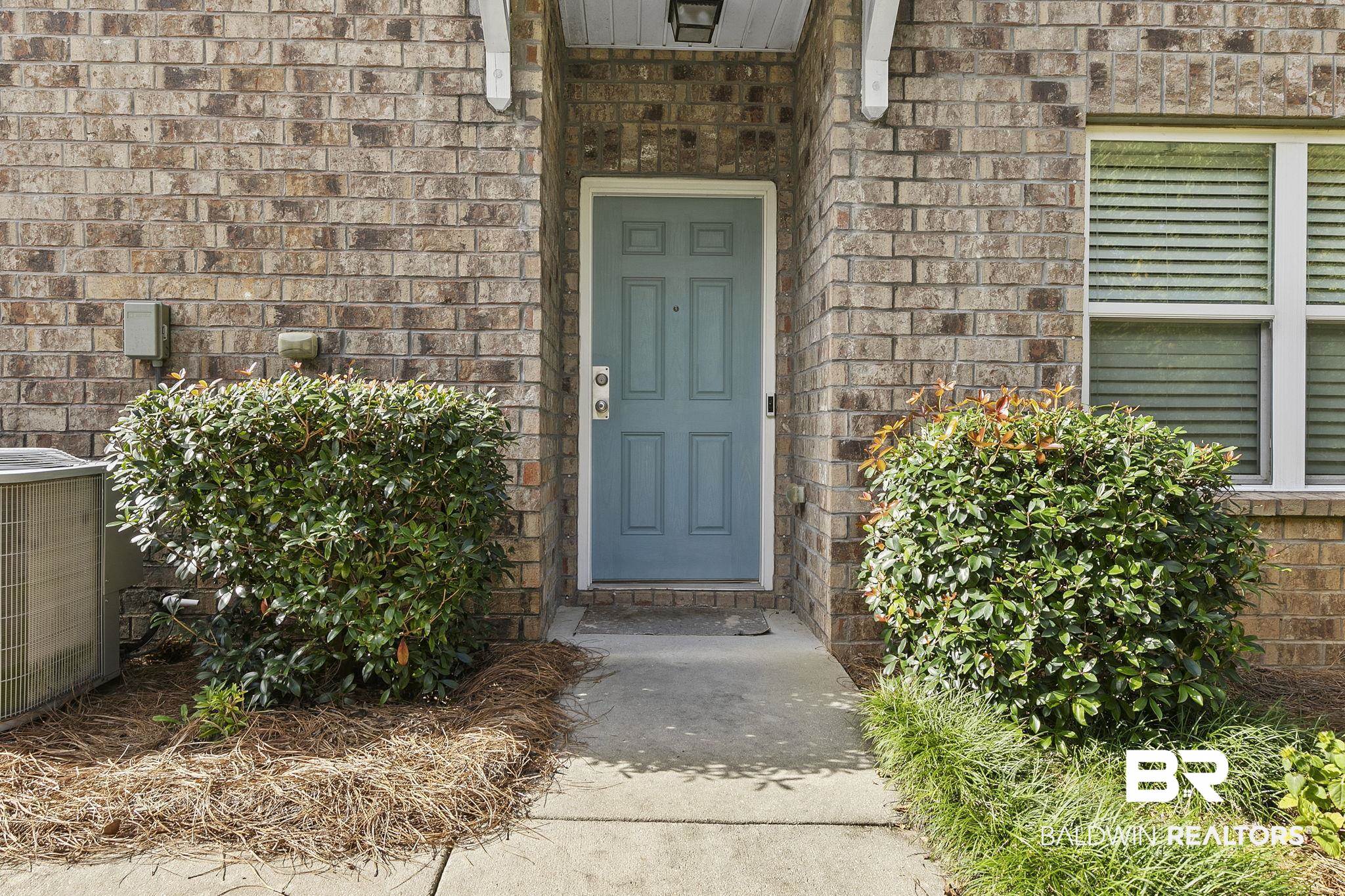 6867 Spaniel Drive, Unit B Daphne, AL 36527 - Photo 5 of 36 Property entrance featuring central AC