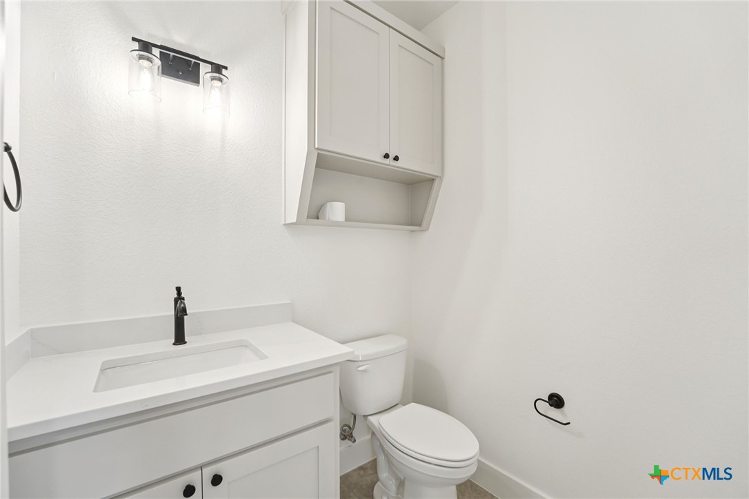 5207 Hollow Ranch Drive Salado, TX 76571 - Photo 19 of 37 a bathroom with a sink a toilet and shower