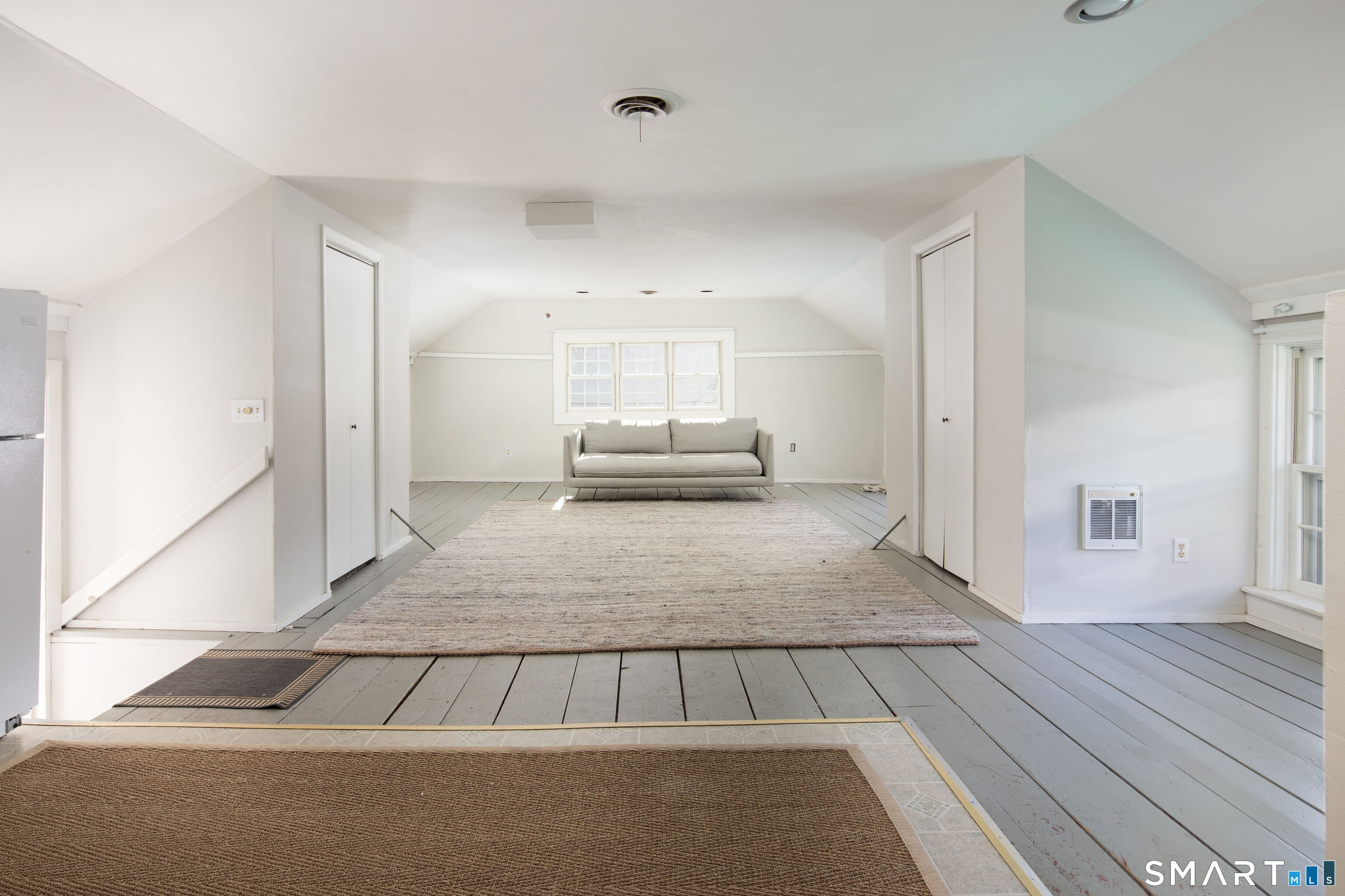 7 Railroad Street Cornwall, CT 06796 - Photo 7 of 8 a living room with a couch and a rug