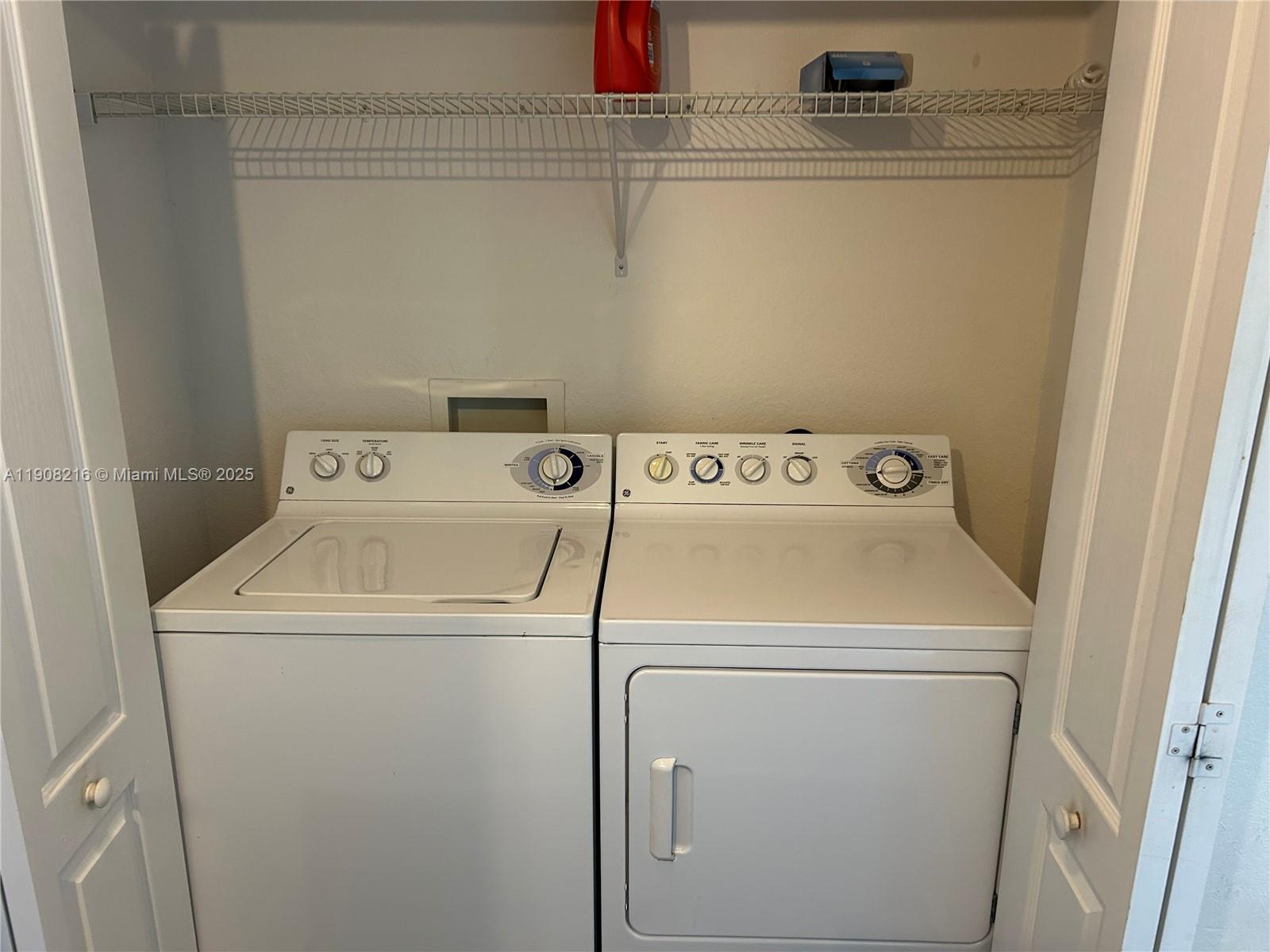 6001 Southwest 70th Street, Unit 551 South Miami, FL 33143 - Photo 16 of 23 a utility room with dryer and washer