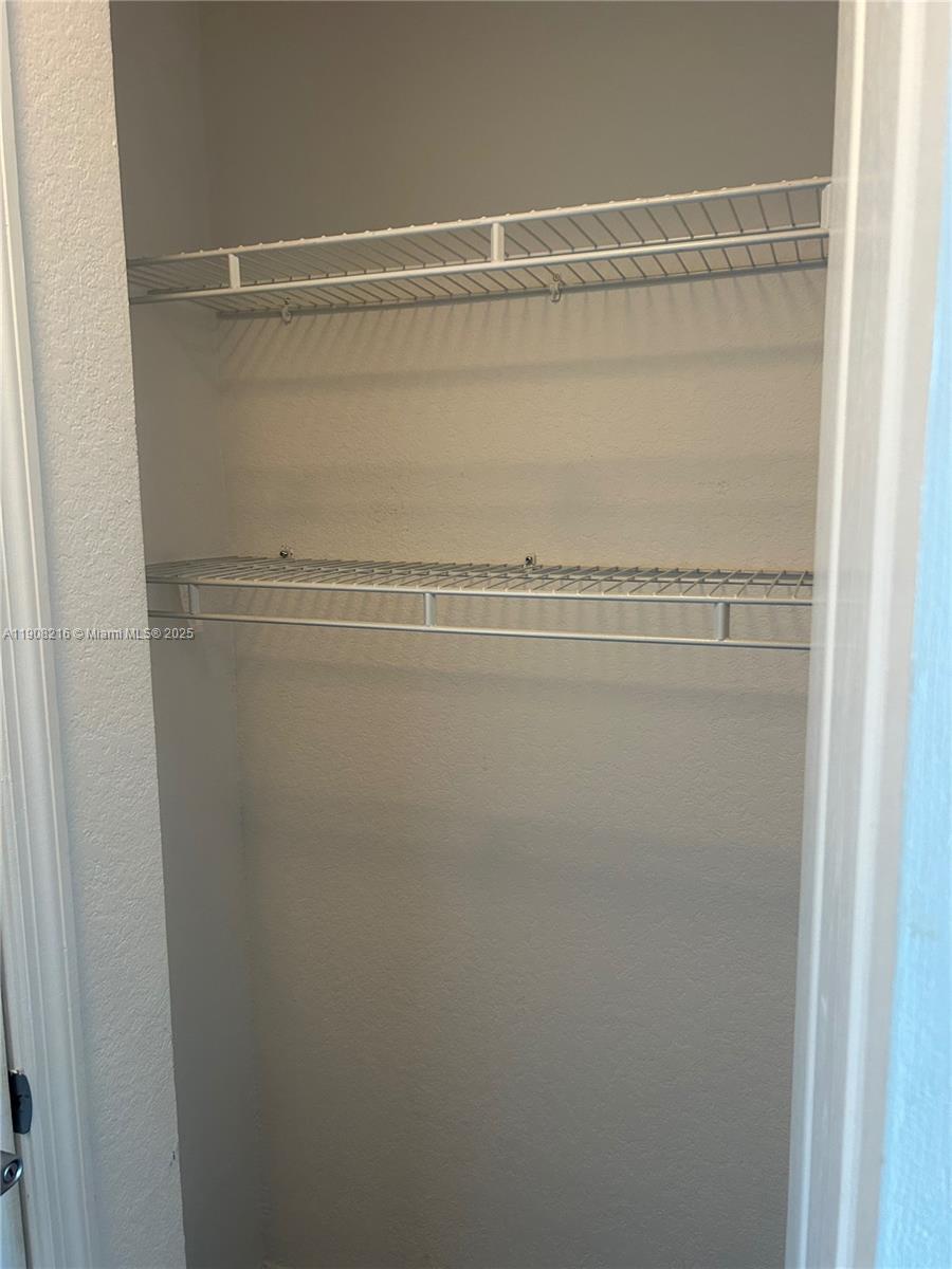 6001 Southwest 70th Street, Unit 551 South Miami, FL 33143 - Photo 8 of 23 a view of a room with racks on the wall