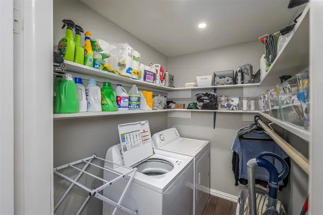 a view of storage and utility room with washer and dryer