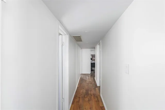 a view of a hallway with closet