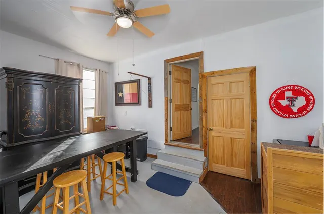 a view of kitchen with cabinets and wooden floor
