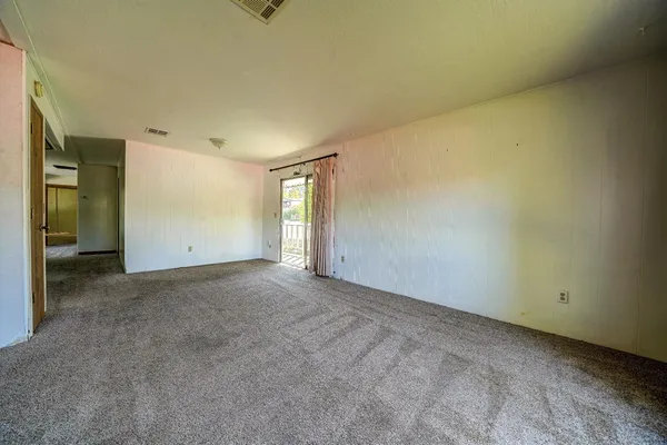 a view of an empty room with a window