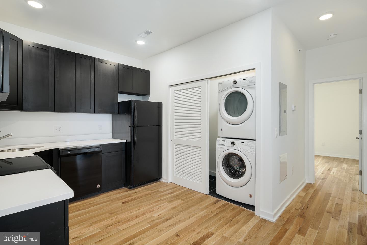 1917 East Letterly Street, Unit F Philadelphia, PA 19125 - Photo 13 of 19 a kitchen with a refrigerator and a stove top oven