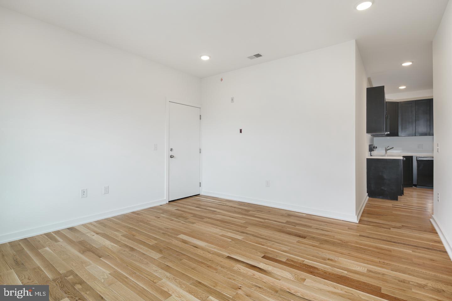 1917 East Letterly Street, Unit F Philadelphia, PA 19125 - Photo 16 of 19 a view of a kitchen with wooden floor and a sink