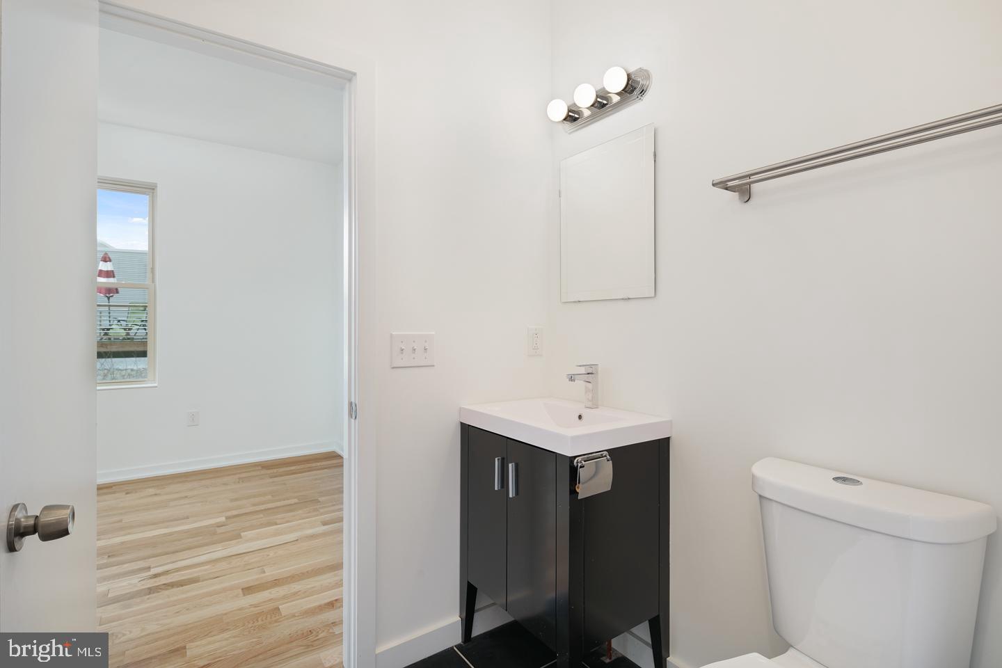 1917 East Letterly Street, Unit F Philadelphia, PA 19125 - Photo 5 of 19 a bathroom with a sink toilet and vanity
