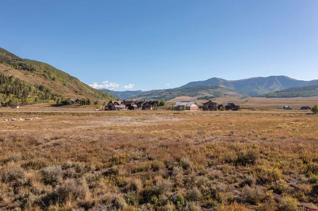 a view of an ocean beach and mountain