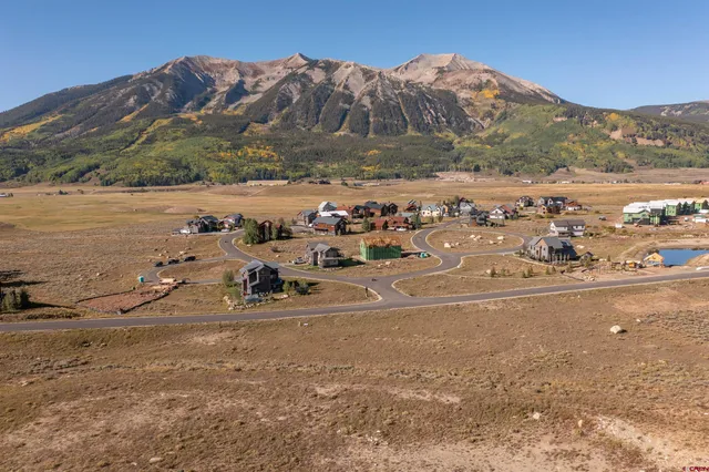 a view of a town with mountains in the background
