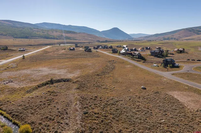 a view of a town with mountains
