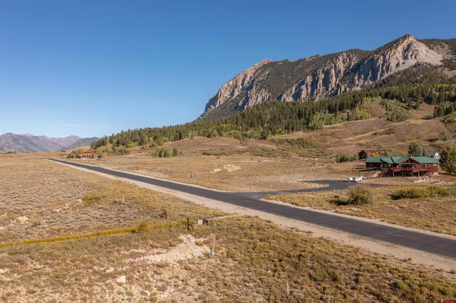 a view of a road with an ocean