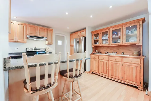 a kitchen with a sink cabinets and window