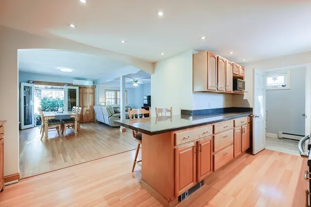a en suite bathroom with a granite countertop sink and a mirror