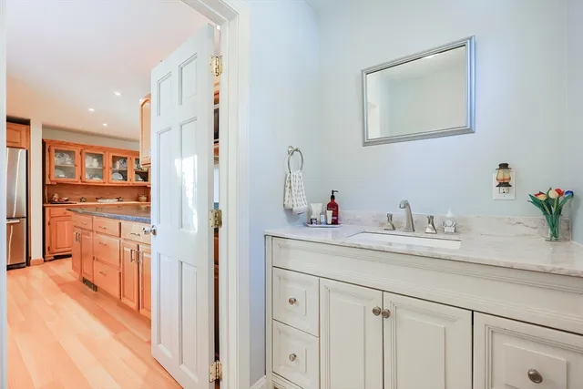 a kitchen with stainless steel appliances granite countertop a refrigerator and a sink